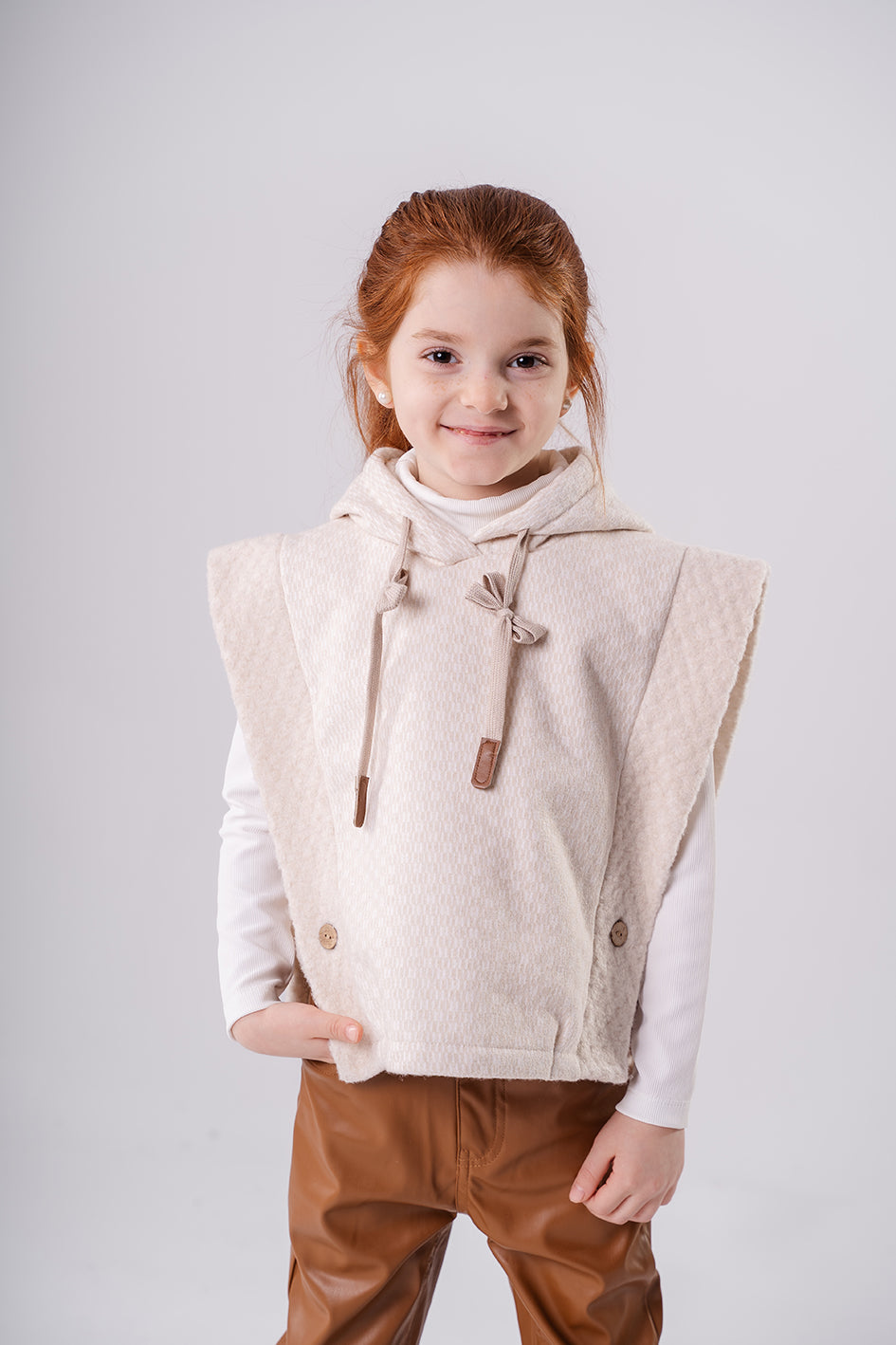 Girls Beige knitted string vest with a hood