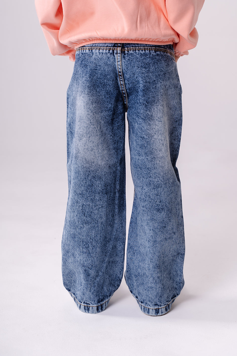 Girls Wide Leg Washed Blue Jeans With a Bottom Cut