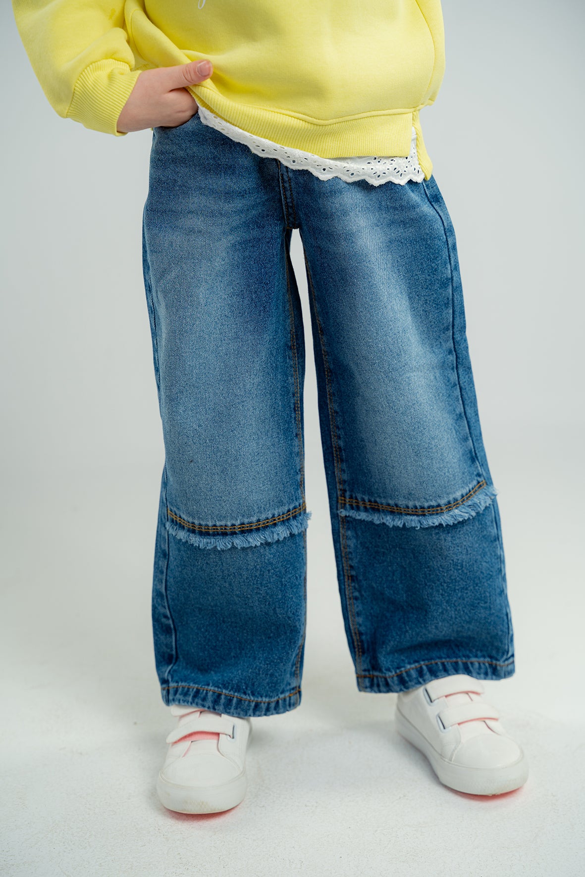 Girls Wide Leg Blue Jeans With a Bottom Cut